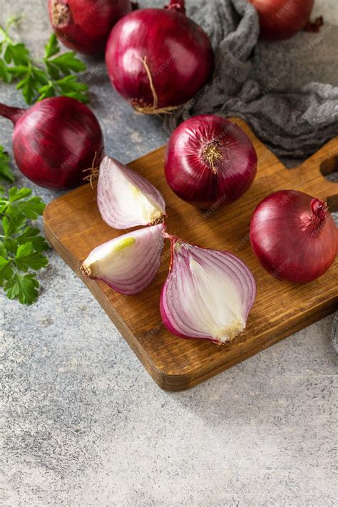 Premium Photo | Purple onions fresh whole purple onions and one sliced