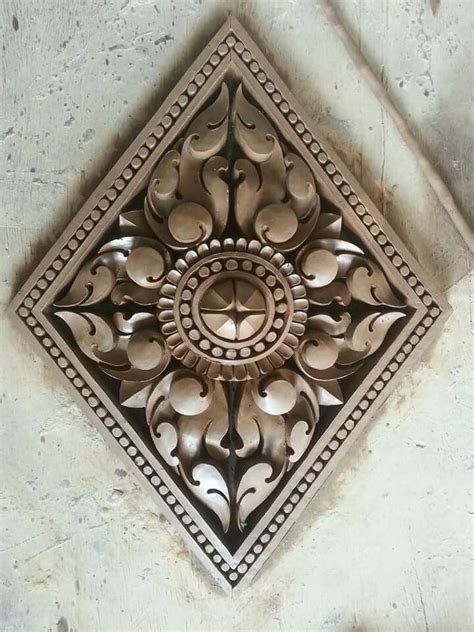 Intricately Designed Metal Object on Building