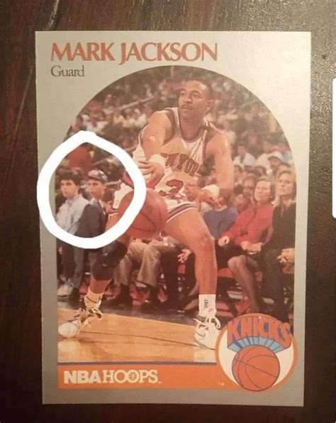 Basketball card with the Menendez brothers sitting courtside