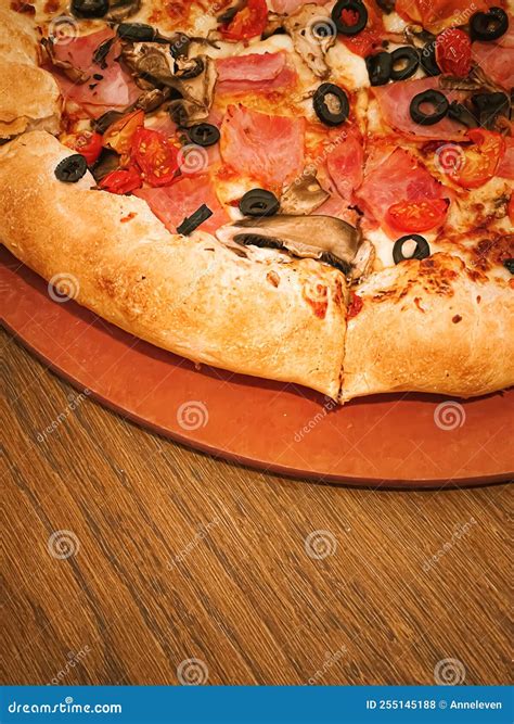 Pizza Capriciosa with Cheese Stuffed Crust in Pizzeria, Food Stock