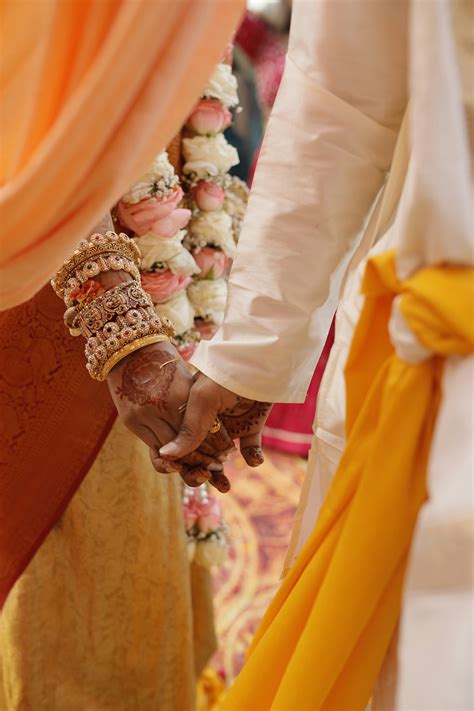 A close up of a person holding hands with another person photo – Free