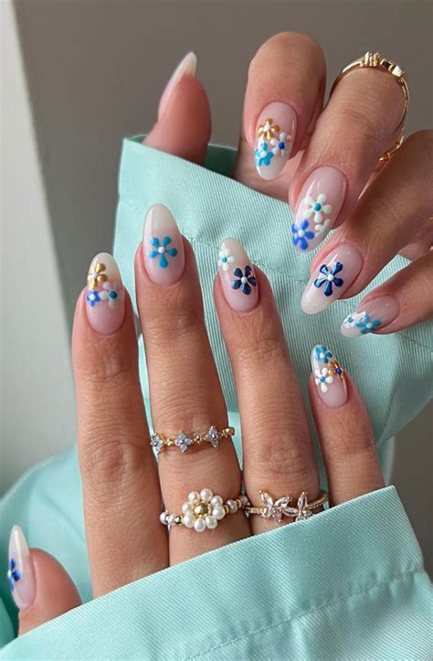 42 Cute Spring Nail Art Inspirations : Milky mani + blue flowers