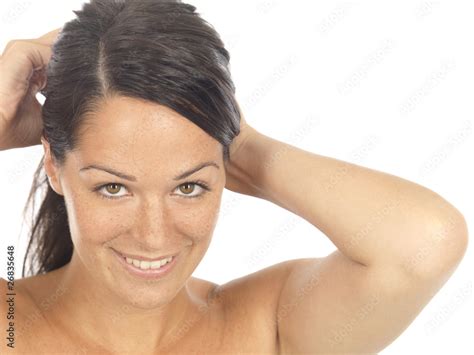 young woman putting hair  model released stock photo adobe stock