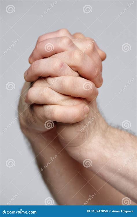 interlocked male hands closeup stock photo image  nonverbal body