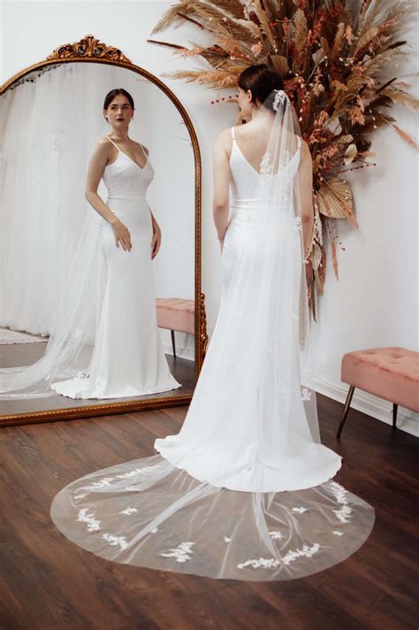 Lacey - two layer chapel length veil with a narrow lace edge