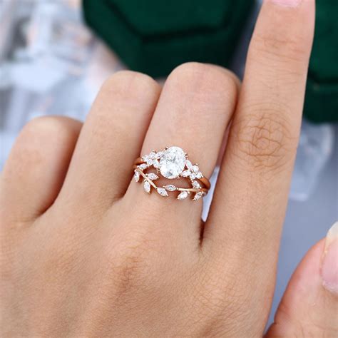 Oval Cut Moissanite Leaf Engagement Ring Set In 14K Rose Gold ...