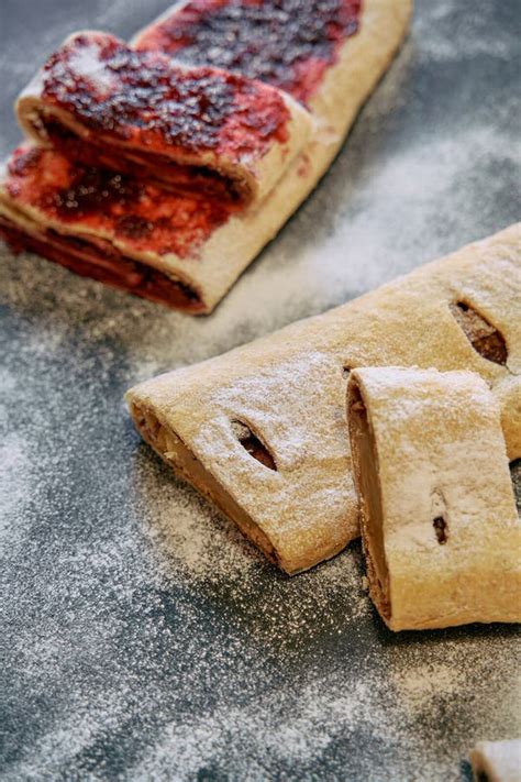 Deliciously Baked Pastries Filled with Sweet Jam and Powdered Sugar ...