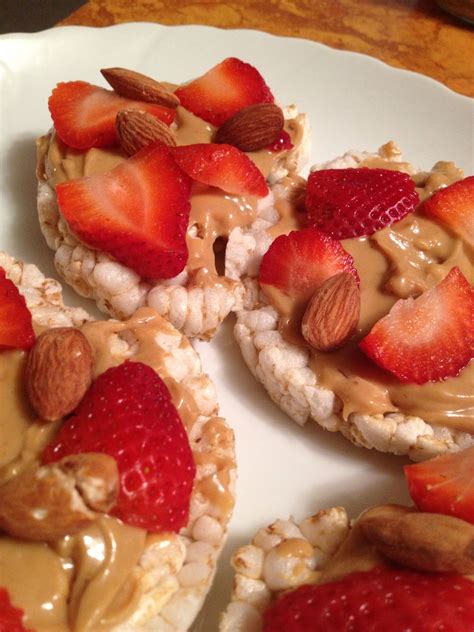 My fav snack rice cakes w/pb,almonds and sliced strawberries!!! Healthy