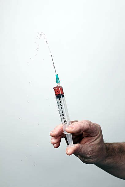 syringe squirting stock  pictures royalty  images istock