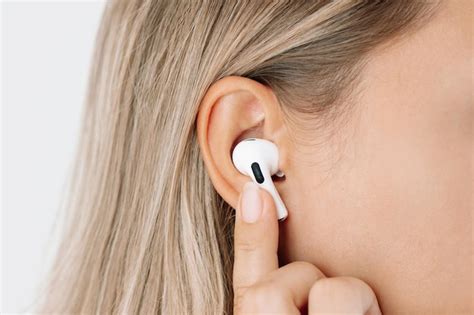 Premium Photo | White wireless headphone for sports running walking in ...