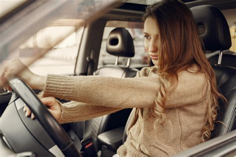 Focused modern woman driving car · Free Stock Photo