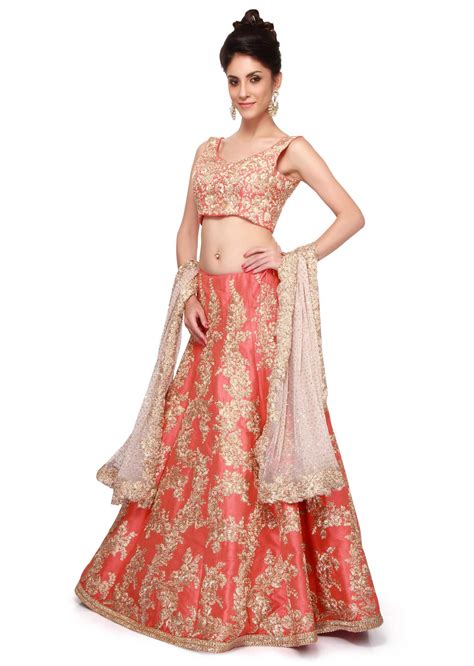 Coral lehenga featuring with gold zari embroidery only on Kalki