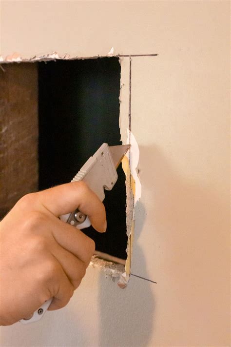 How to Fix Holes in Drywall | Patch a Hole in Drywall | HGTV