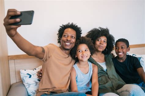 Premium Photo | Portrait of family taking a selfie together with mobile ...