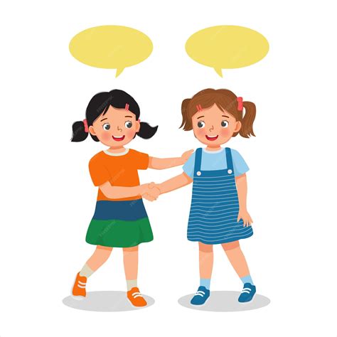 Dos niñas lindas dándose la mano introduciéndose o felicitándose unas a