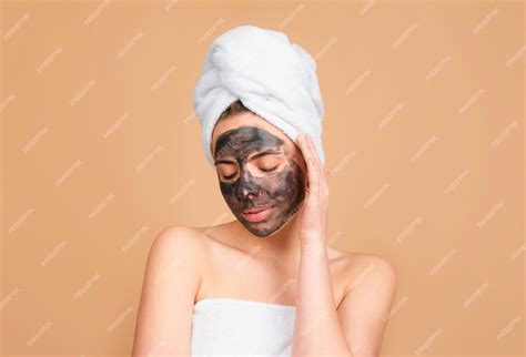 premium photo beautiful girl  mud   face cosmetic mask