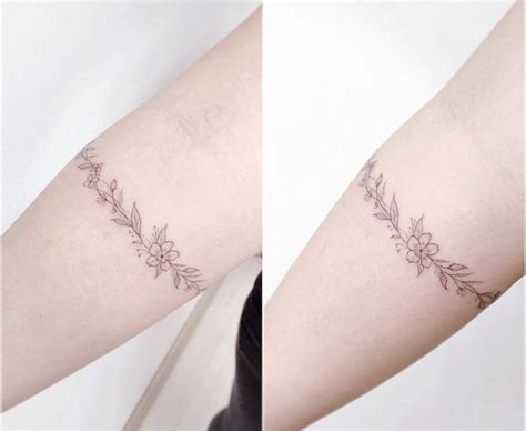 flower armband tattoo    forearm