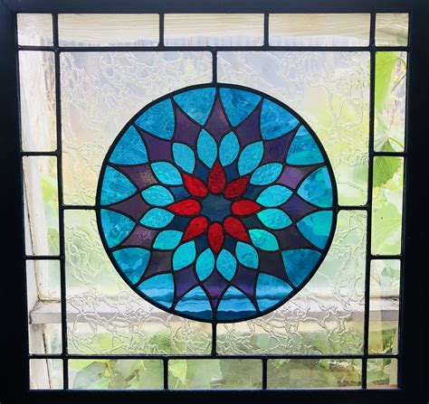 My dad is an amateur stained glass maker. He designed and made this for