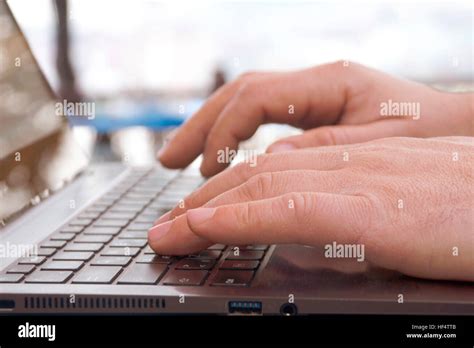 Hands typing on laptop computer Stock Photo - Alamy