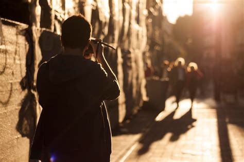 premium photo photographer capturing  moment  sunset