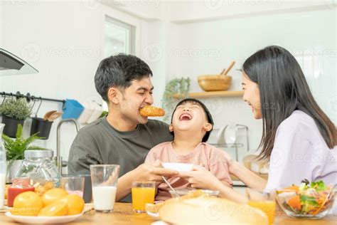 Happy refreshment family breakfast in morning, asian young parent