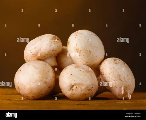 champignons mushrooms  basket  wooden table  brown background