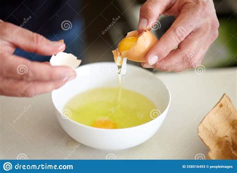 You Have To Crack Some Eggs To Make an Omelette. Cropped Image of a Man ...
