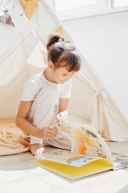 premium photo preschooler child reading book  home