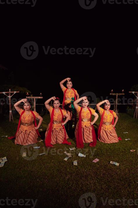Asian dancers take pose with dance movements while performing the