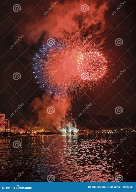 Colorful Fireworks in the Night Sky on the Seafront of Alicante Spain