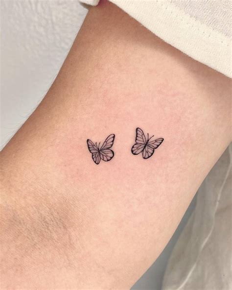 minimalistic style butterfly couple tattoo located