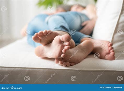Loving couple feet stock photo. Image of lesbian, couch - 39558838