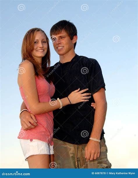 Happy teen couple embrace stock photo. Image of laughing - 6087878