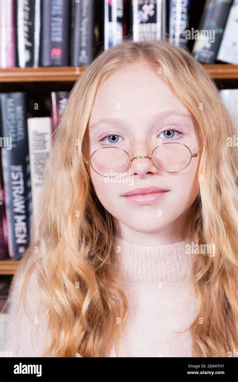 Cute 12-year-old girl wearing old-fashioned spectacles Stock Photo - Alamy