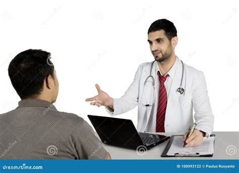 italian doctor discussing   patient  studio stock photo