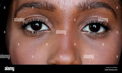 Close-up African young woman eyes looking at camera, Macro closeup ...