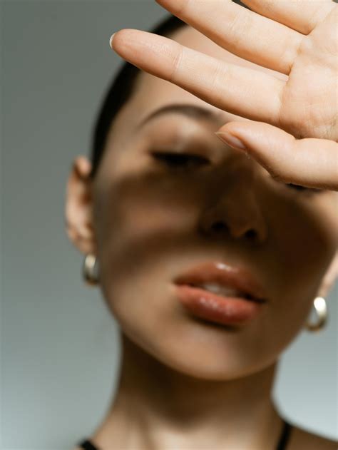 close  photo  hand  womans face  stock photo