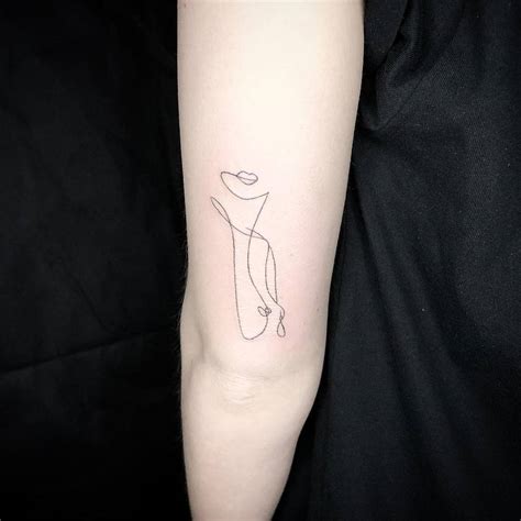 single  nude woman tattoo   tricep