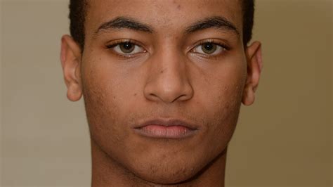 Red Devils even record with road win over Trojans