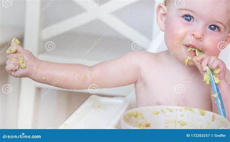 baby eating  solid food stock image image  smiling vegetables