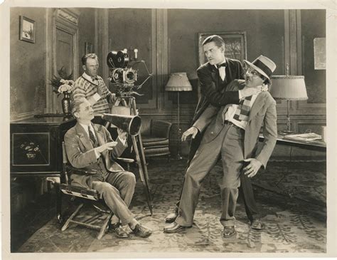 Original photograph of comedian Charley Chase choking director Leo
