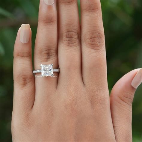 princess cut engagement ring on finger