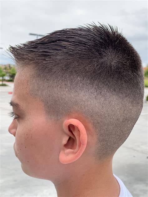 Schools react to student haircuts for men with designs 11