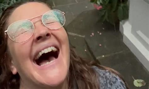This viral video of Drew Barrymore playing in the rain will give you life