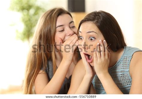 Portrait Girl Telling Secrets Her Amazed Stock Photo 556710889 ...