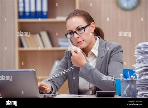 Busy stressful woman secretary under stress in the office Stock Photo ...