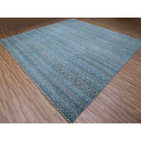 Interior designers debate 12 x 12 rug placement in modern homes 23