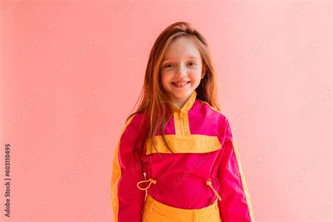 Portrait of little girl on pink background Stock Photo | Adobe Stock