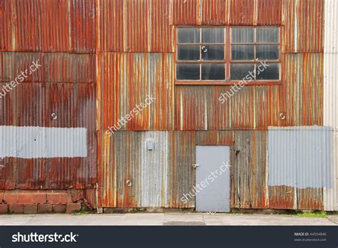 Rusted Corrugated Metal Wall Of A Warehouse Building In A ...