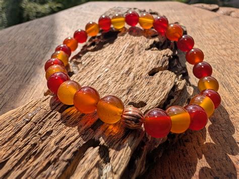 carnelian elasticated beaded bracelet  mm copper accent ripples